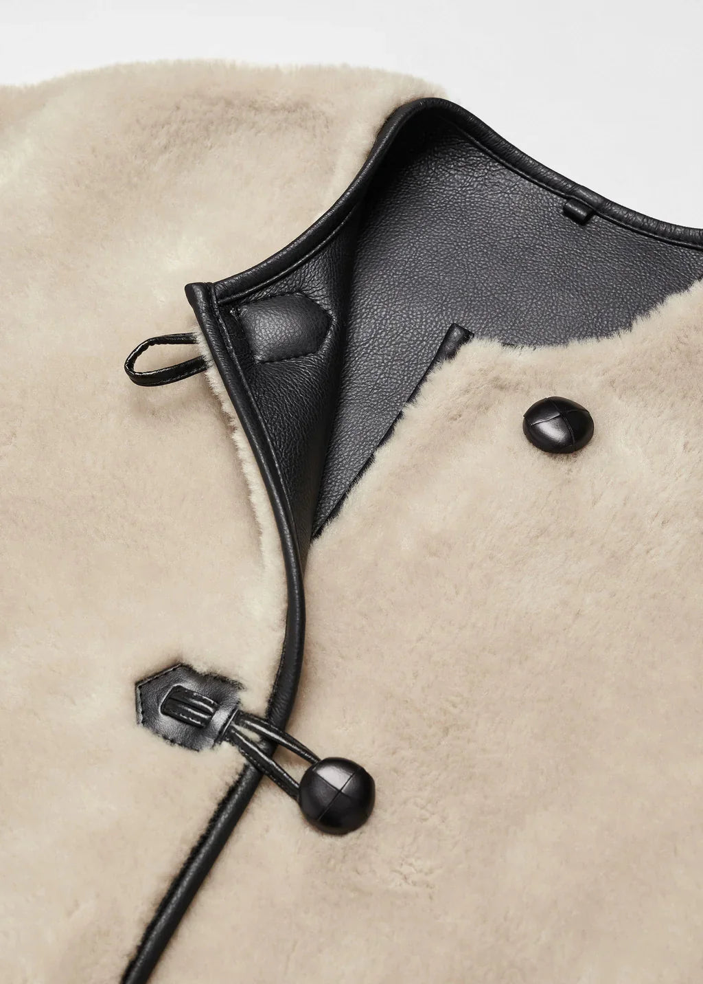 Faux fur coat with applications