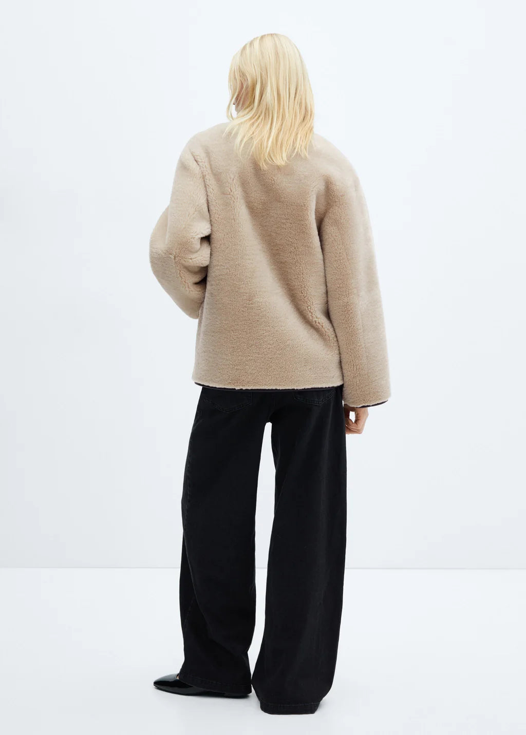 Faux fur coat with applications