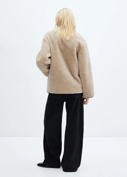 Faux fur coat with applications