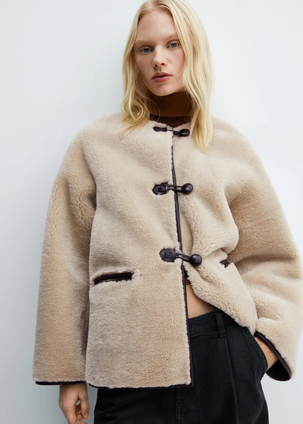 Faux fur coat with applications